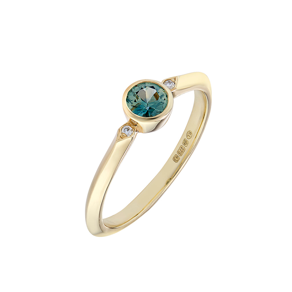 Round teal coloured sapphire and diamond engagement ring 
